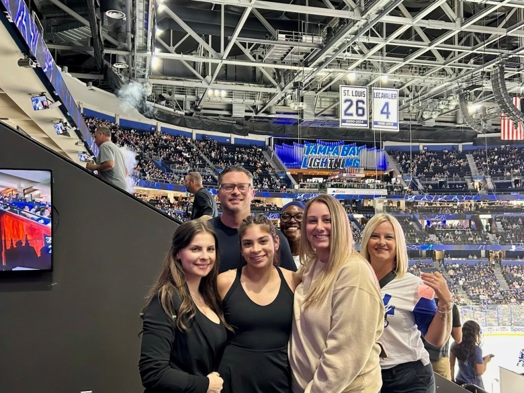 Staff members in a hockey game